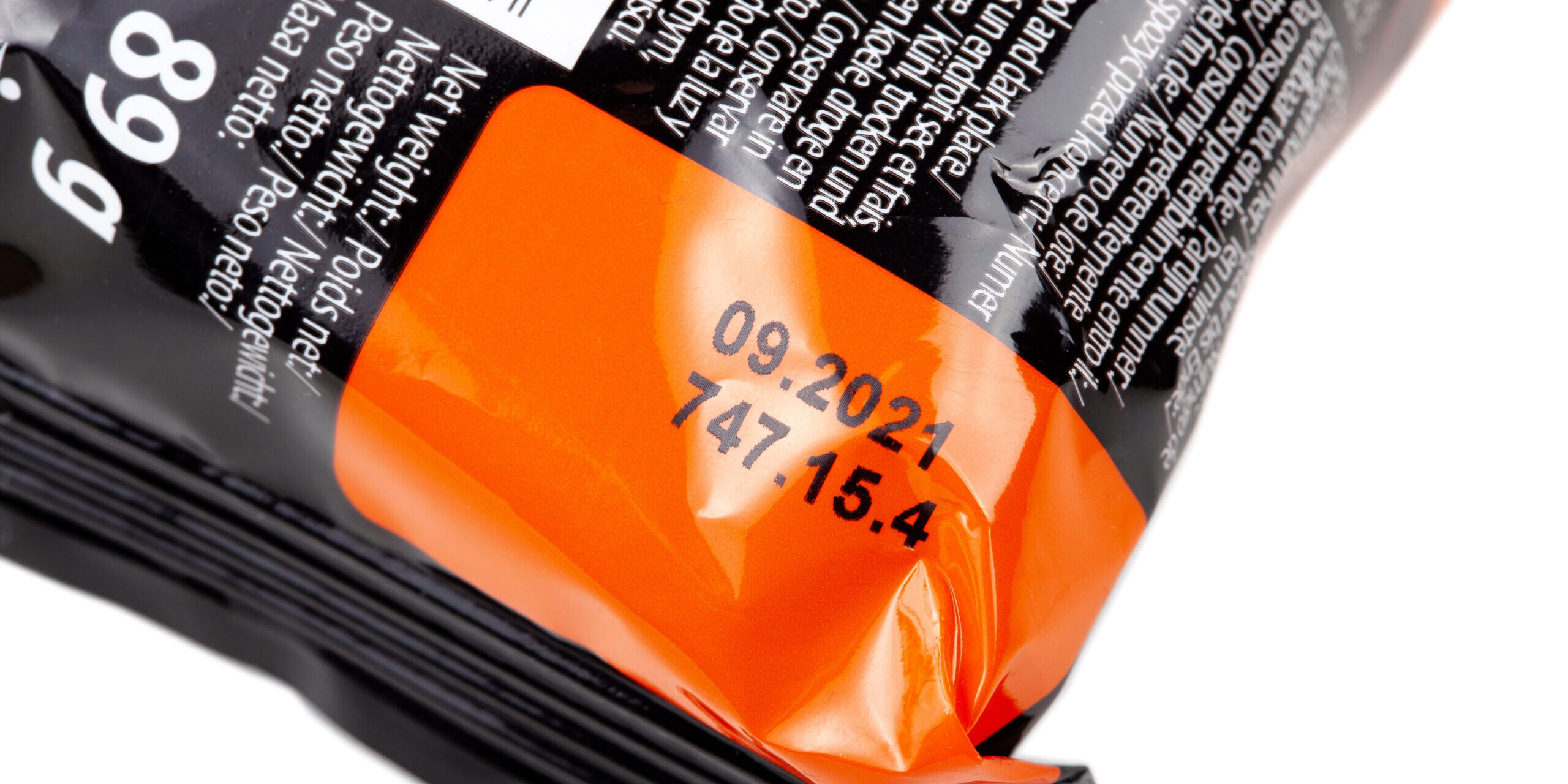 Old packed food past expiration date, date printed on plastic fo